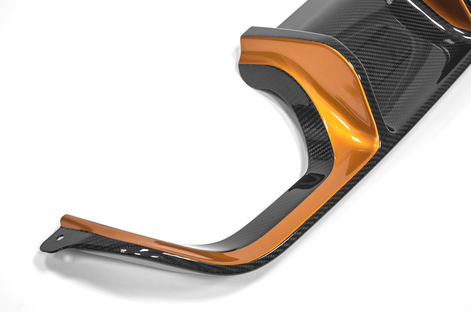 A fragment of black and orange diffuser on a white background