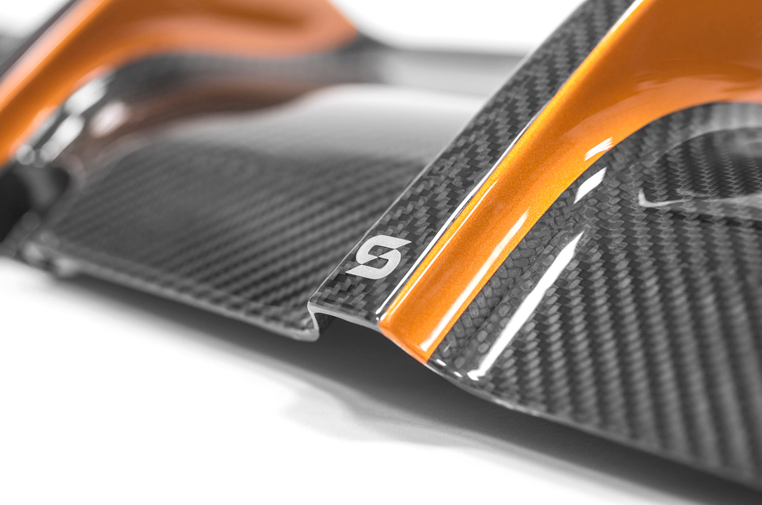 close-up of a black and orange diffuser on a white background