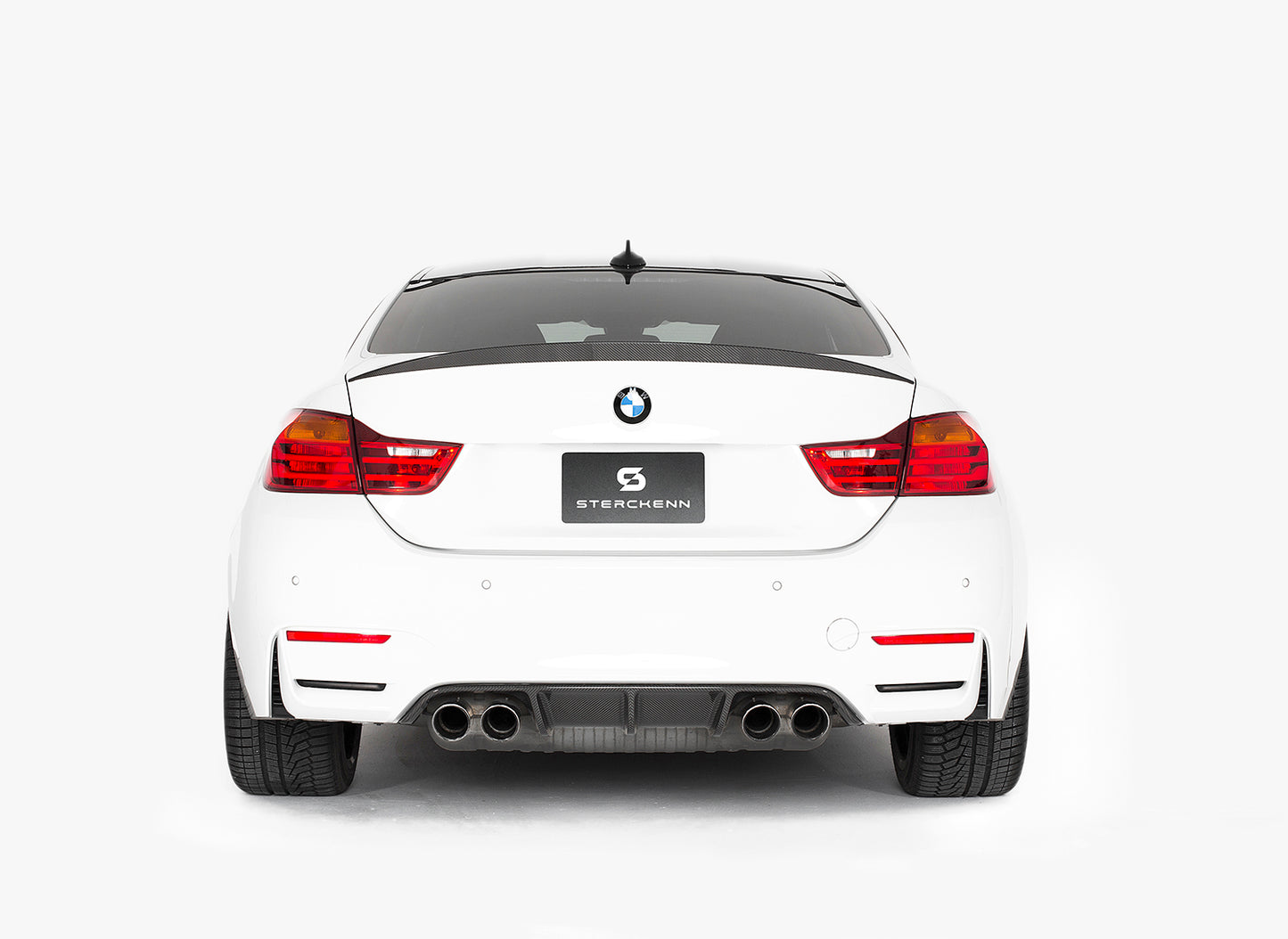 rear view of white BMW with sterckenn logo, white background