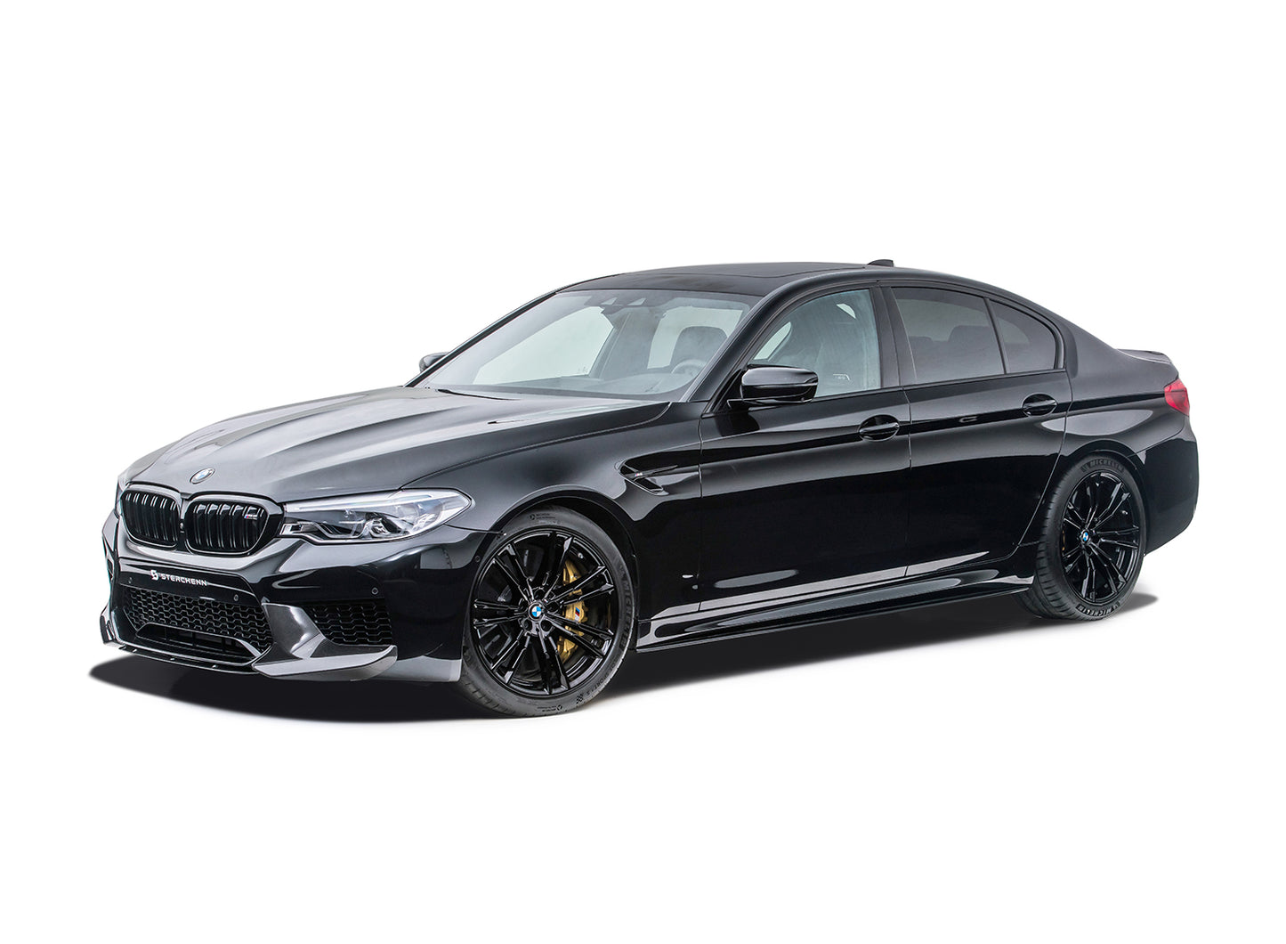 Black BMW M5 (F90) on a white background