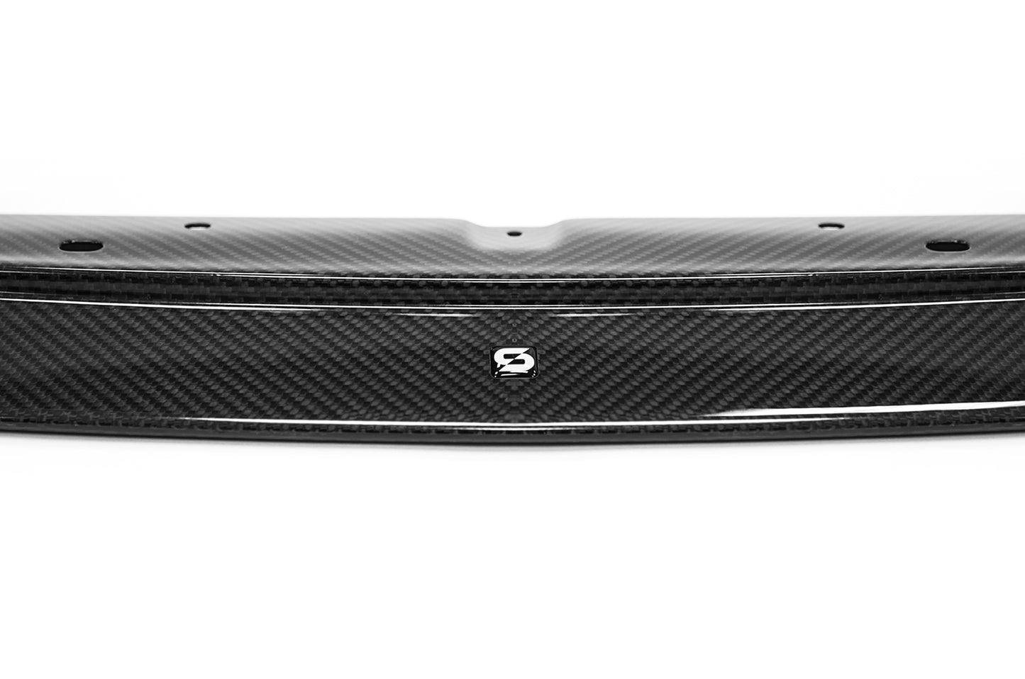 close-up of black splitter with S sticker on white background