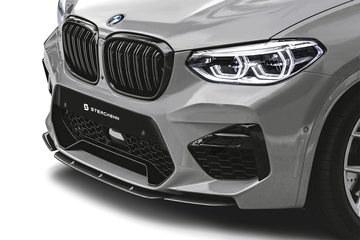 Bumper of a silver BMW X3M (F97) on a white background
