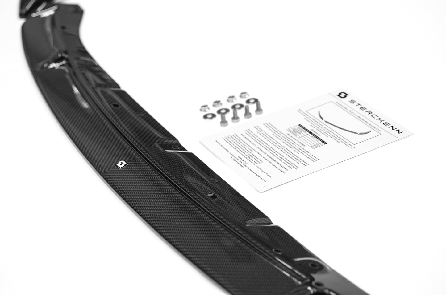 black splitter,instructions and screws on white background