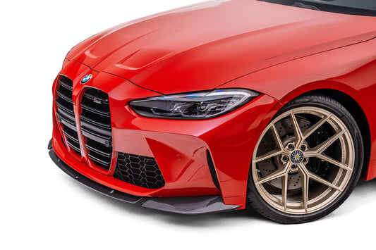 front of red bmw with black splitter on white background