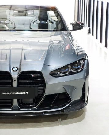 front view of silver bmw at the dealership